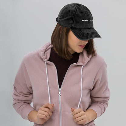 Woman wearing the Make Tracks vintage cap